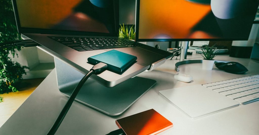 Stylish home office setup featuring laptop and external drives for data storage and backup.