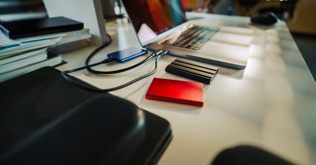 Modern Office Desk with Laptop and External Drives